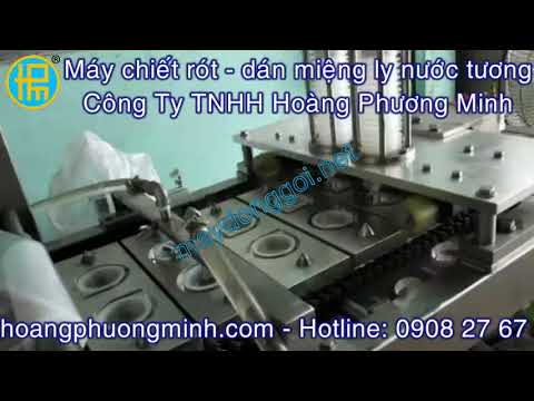 Máy chiết rót - dán miệng ly nước chấm (băng tải)