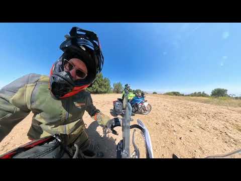 Two old guys ride ADV bikes slow up an easy hill.