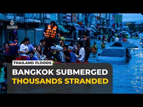 Thai capital flooding: Police help evacuate thousands of people from homes