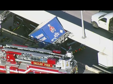 Dramatic helicopter video shows emergency crews rescue driver from truck hanging off the highway