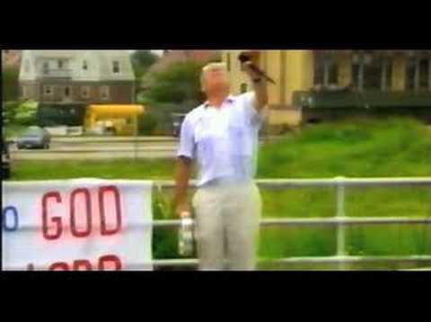 Trailer still of highway and transit montage underscored by road-rock cues