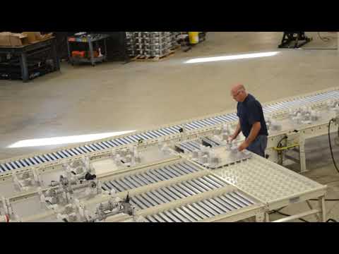 Pallet Accumulation Conveyor with Operator work stations and Buffer storage