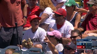 Fan makes one-handed snag on a flying bat