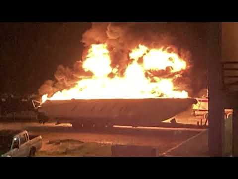 Coast Guard officer detained after allegedly setting a boat on fire