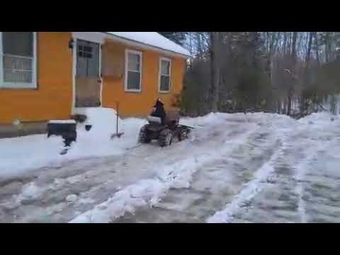 Trina plowing snow on her Wheelhorse 867