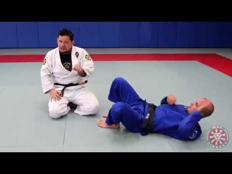 Armbar Escape from Guard (Saulo Ribeiro - BJJLibrary.com)