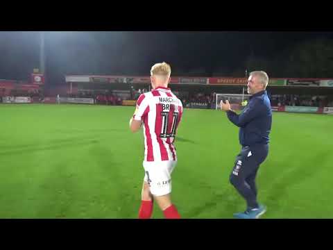 Cheltenham Town players and staff celebrate a 2-0 win over Carlisle United