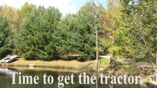 Using my Kubota L3301 HST Diesel Tractor to Push Black Willow Over and Pull it out of Lake