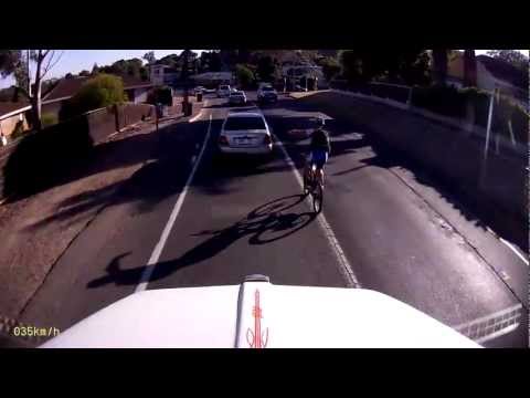 Cyclist forces oncoming traffic to dodge him as he overtakes