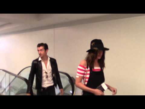 Alex Turner and Arielle Vandenberg talk about One Direction as they depart at LAX Airport