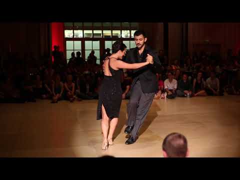  Adrian Ferreyra  and  Dana Frigoli  are  dancing  to  the  tango  "  Dime Mi Amor  "  at  Tango Element Baltimore  in  2017