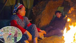 Download lagu The loving mother stays up late lighting a fire to warm her sleeping son. mp3