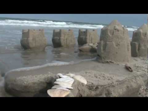 Sand Castle Destruction by Wave