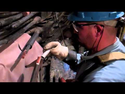 Con Edison Crew Repair Electrical Equipment in NYC Manhole