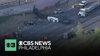 Car carrier truck overturns, blocks I-95 northbound near Commodore Barry Bridge