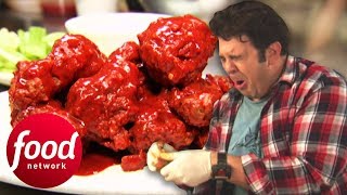 Download the video "Adam Suffers To Eat 12 Jumbo Wings Dipped In A Sauce 400 X's Hotter Than Fresh Jalapeño | Man v Food"