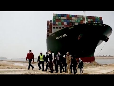 Egypt suspends traffic in Suez Canal as crews try to free grounded ship