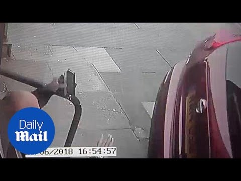 Barber has a close shave when narrowly avoiding wayward car