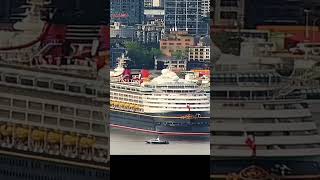 Disney Magic arrives from drydock, gets buzzed by seaplane and helicopter