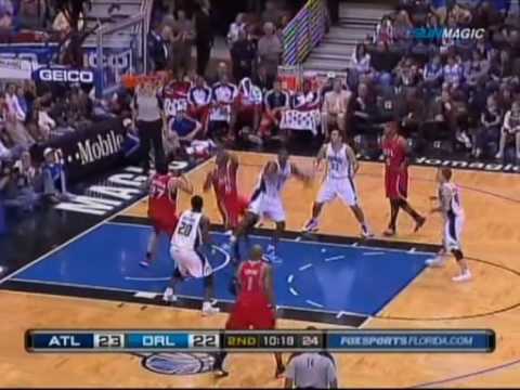 Mario West pulls an offensive rebound against Dwight Howard.mkv