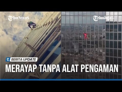 AKSI MANUSIA SPIDERMAN BARENG ANAK PANJAT GEDUNG TERTINGGI DI BARCELONA