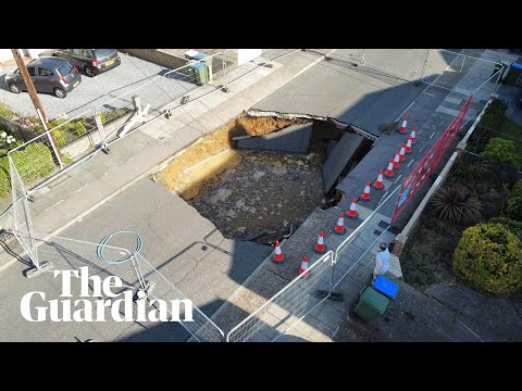 Residents peer into huge sinkhole in south-east London