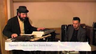 "Soul Bossa Nova" performed by Paparazzi Cocktail Duo
