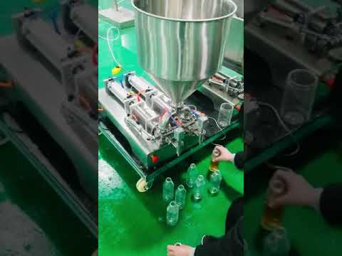 Two heads piston filler semi automatic oil cream sauce filling machine test run Manual mode