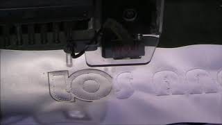 E Laser II attached to a Barudan Embroidery Machine at a show