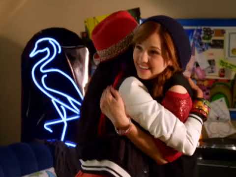 Radio Rebel 2012 Disney Channel official trailer frame — Tara at the mic and Seattle nighttime cutaways