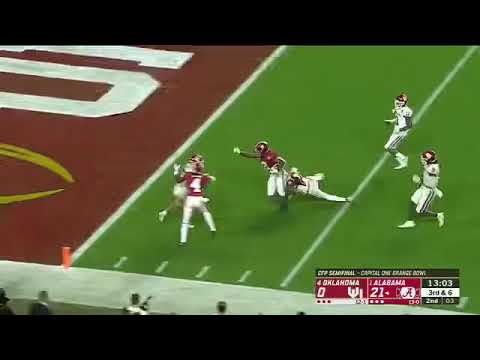 Josh Jacobs trucks an Oklahoma defender for a touchdown