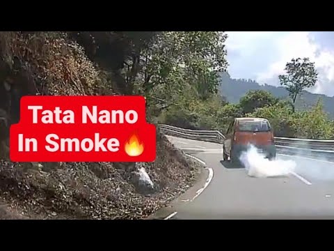 Tata Nano In Smoke Driving Uphill