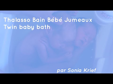 Twins Holding Each Other During Bath