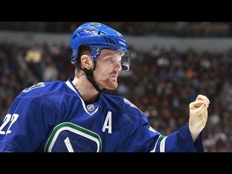 Daniel Sedin pulls tooth out after high stick