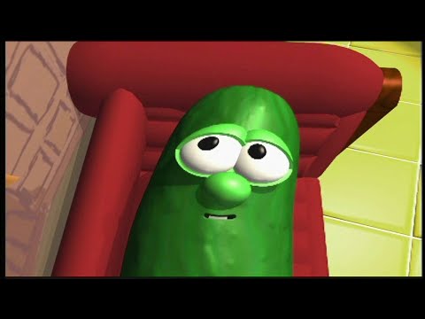 Green pickle character with large eyes and a small smile, lounging on a red couch in a bright room.