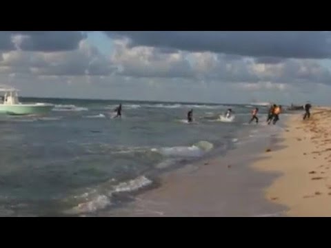 Boatload of immigrants storm Miami beach