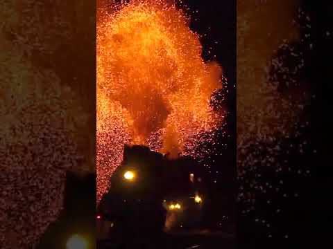 The steam train runs at night in Xinjiang