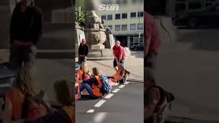 German Just Stop Oil protesters dragged off road