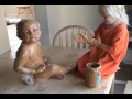 Sister Covers Baby Brother in Peanut Butter