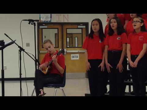 Caroline Dale accompanying 7th grade chorus on the ukulele.