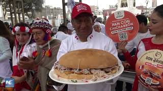 Peruanos disfrutan del “pan con chicharrón más grande del mundo” creado en Lima