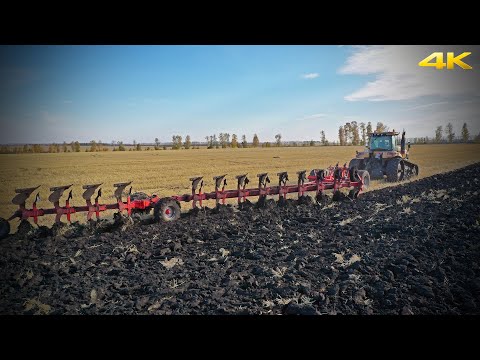 Big tractors need big plows: CAT Challenger MT845B track tractor with a 12-furrow reversible plow
