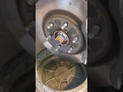 2017 Nissan Titan SL front brake pad and rotor replacement. 1 of 2