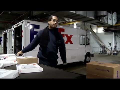 FedEx shares slide as annual forecast cuts stoke worries on economy | REUTERS