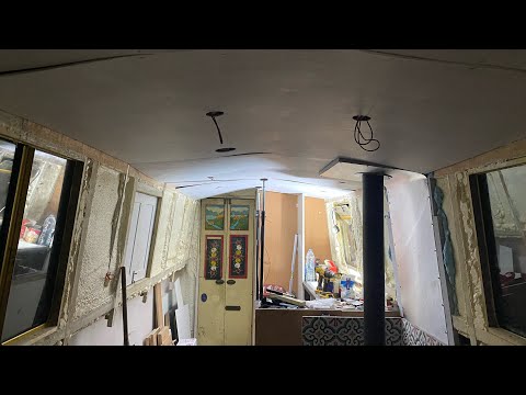 117. Galley ceiling panels go up and come down