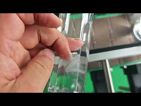 Transparent label round bottle labeling machine working video