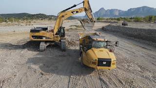 Riverbed Expansion & Flood Protection with CAT 374D & Articulated Trucks – Drone View - Interkat SA