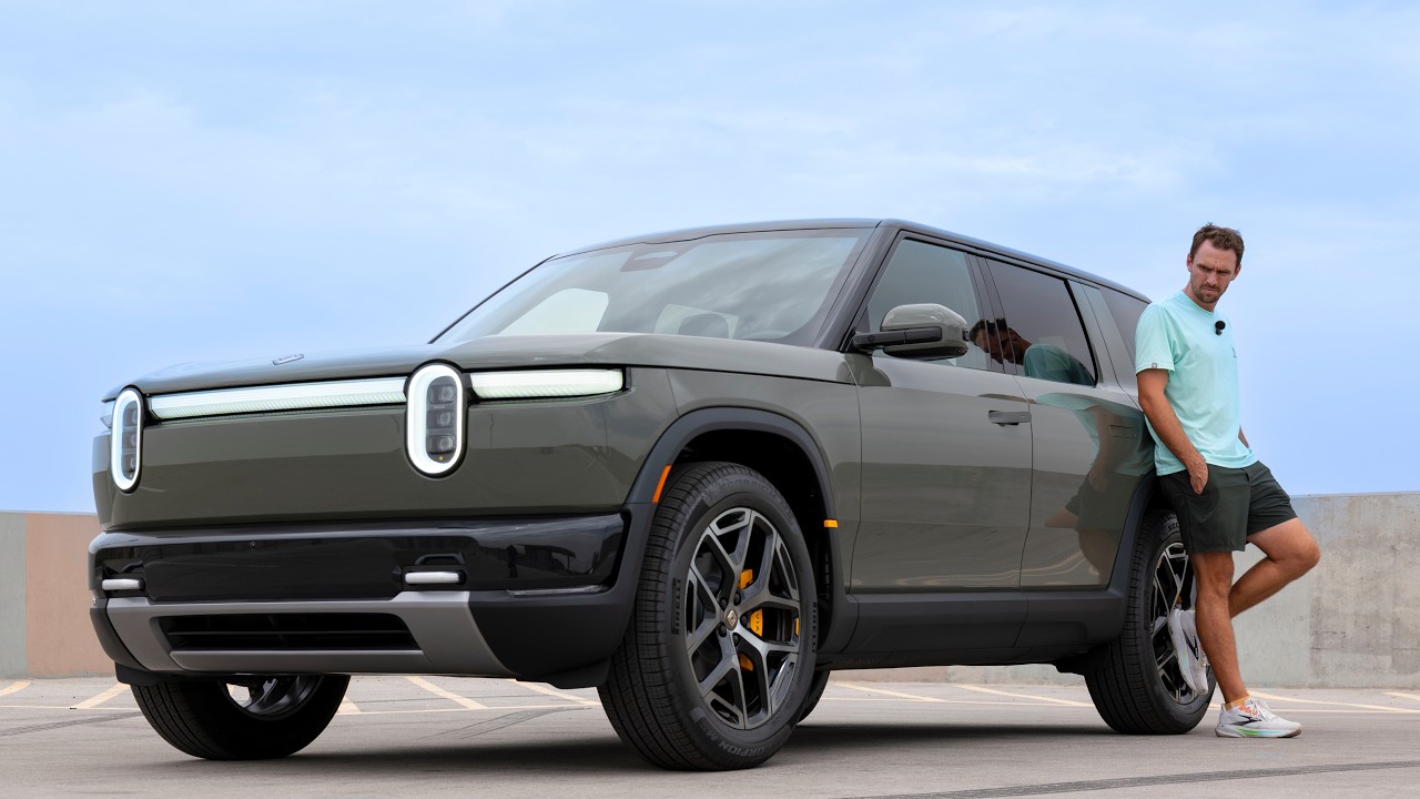 Rivian R2 in launch green driving on a highway