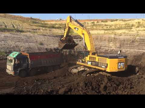 Caterpillar 385C L Excavator Loading Coal On Trucks