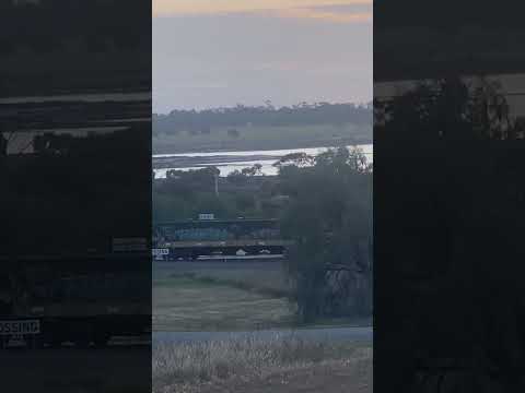 XR552, XR557 & XR551 pulling a freight train pass Boort